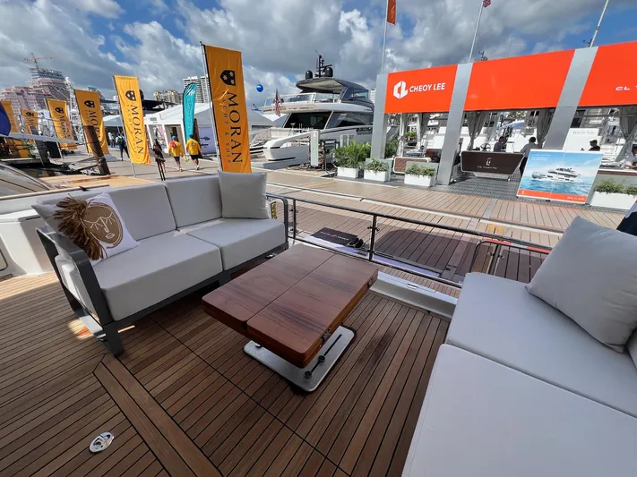  Yacht Photos Pics Luxurious 2024 Sirena 48 Flybridge yacht interior with elegant seating and wooden deck.