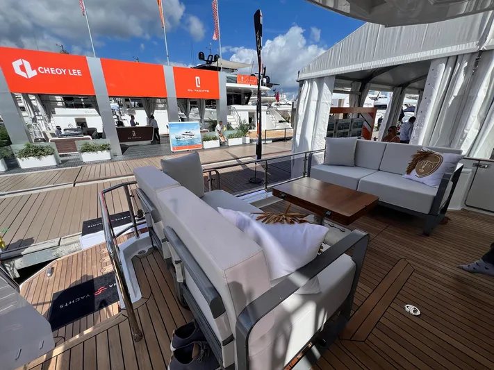  Yacht Photos Pics Luxurious 2024 Sirena 48 Flybridge yacht interior with elegant seating and wooden deck.