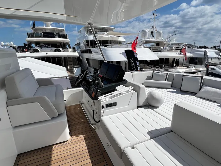  Yacht Photos Pics 2024 Sirena 48 Flybridge yacht interior with luxurious seating and navigation equipment.