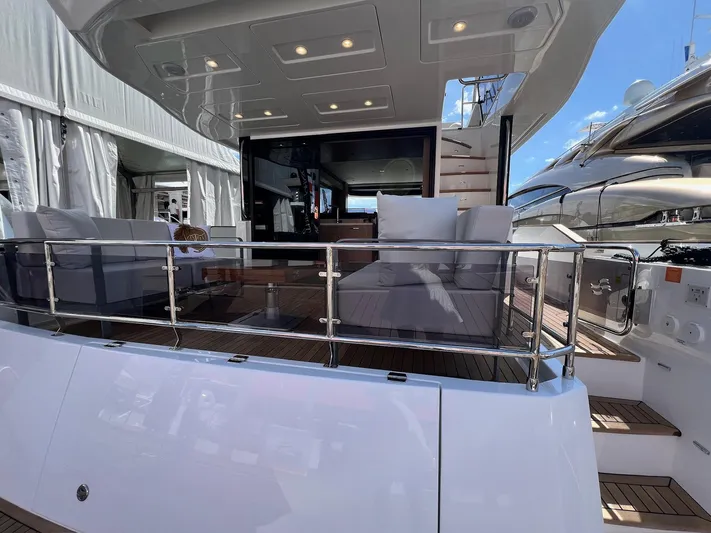  Yacht Photos Pics 2024 Sirena 48 Flybridge yacht deck with seating and modern design.