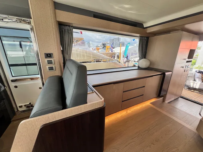  Yacht Photos Pics Luxurious interior of 2024 Sirena 48 Flybridge yacht with modern wood finishes.