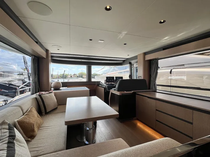  Yacht Photos Pics Luxurious interior of 2024 Sirena 48 Flybridge yacht with modern seating and panoramic windows.