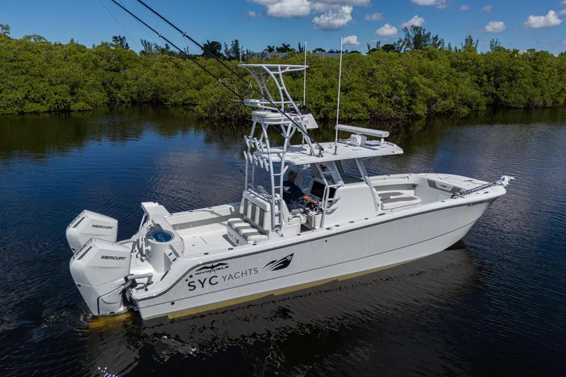 Final/final Yacht Photos Pics 2025 Invincible 33 Catamaran on calm water, featuring dual Mercury engines.