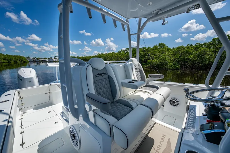 Final/final Yacht Photos Pics 2025 Invincible 33 Catamaran interior with luxurious seating and scenic waterway view.
