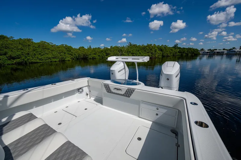 Final/final Yacht Photos Pics 2025 Invincible 33 Catamaran on calm water, featuring sleek design and powerful engines.