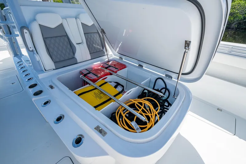 Final/final Yacht Photos Pics Storage compartment of 2025 Invincible 33 Catamaran with safety equipment and cables.