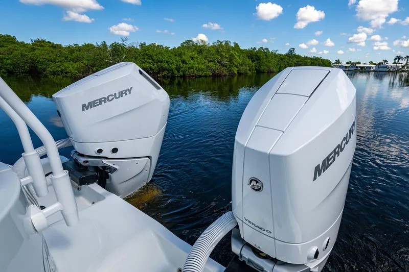 Final/final Yacht Photos Pics Twin Mercury outboard engines on 2025 Invincible 33 Catamaran, cruising in scenic waters.