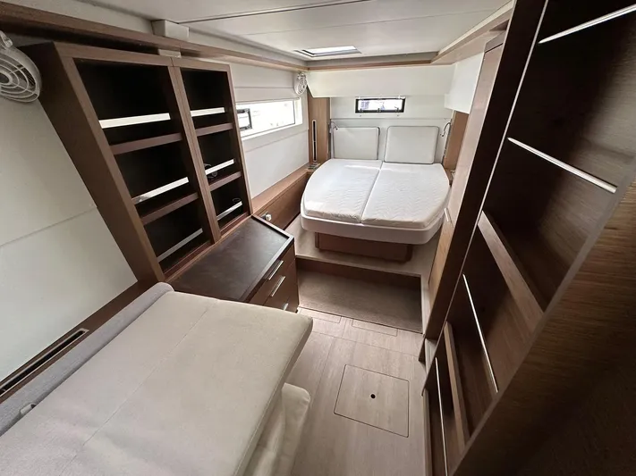  Yacht Photos Pics Luxurious interior cabin of 2021 Lagoon 46 catamaran with modern furnishings.