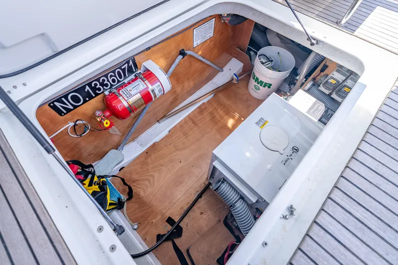 Good Timimg Yacht Photos Pics Engine compartment of 2015 Beneteau Swift Trawler 34 with fire extinguisher and equipment.