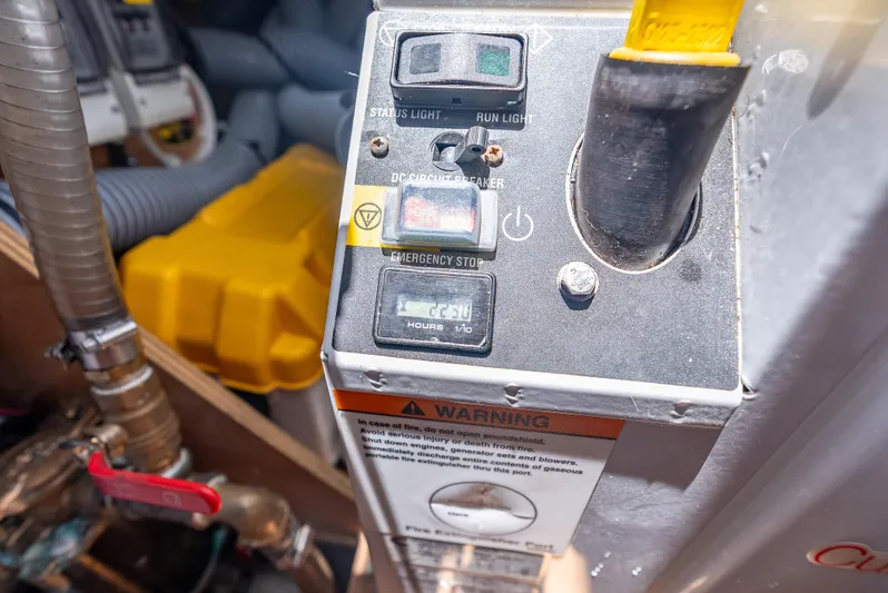 Good Timimg Yacht Photos Pics Control panel of a 2015 Beneteau Swift Trawler 34 with emergency stop and warning label.