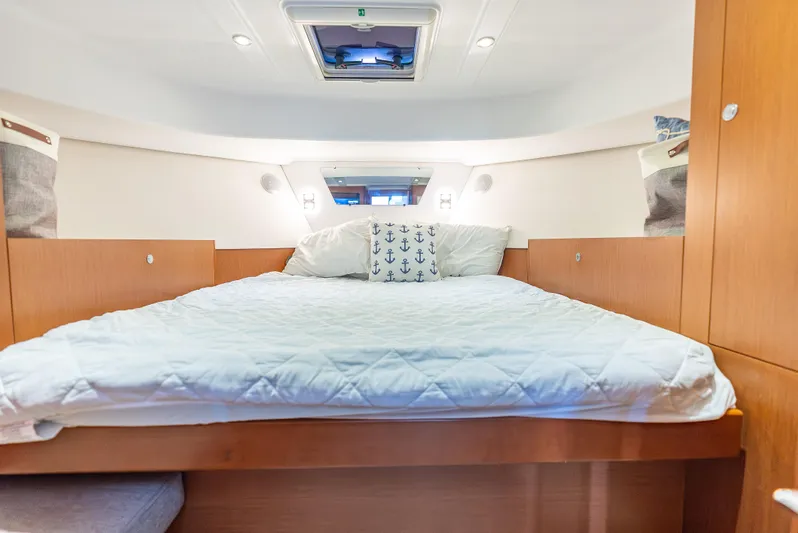 Good Timimg Yacht Photos Pics Cozy bedroom in 2015 Beneteau Swift Trawler 34 with nautical-themed decor.