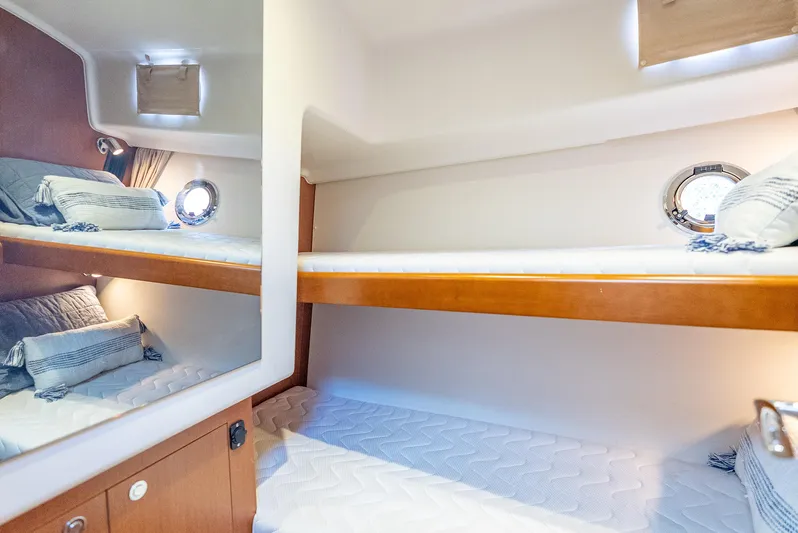Good Timimg Yacht Photos Pics 2015 Beneteau Swift Trawler 34 cabin with cozy bunk beds and nautical decor.