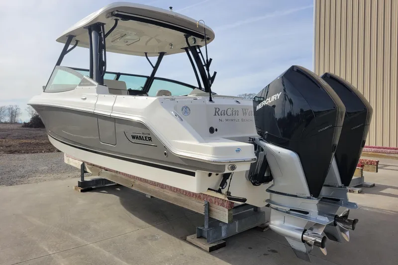  Yacht Photos Pics 2023 Boston Whaler 280 Vantage boat with dual Mercury engines on display.