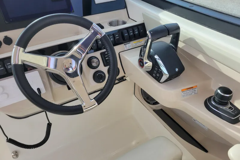  Yacht Photos Pics 2023 Boston Whaler 280 Vantage helm with steering wheel and controls.