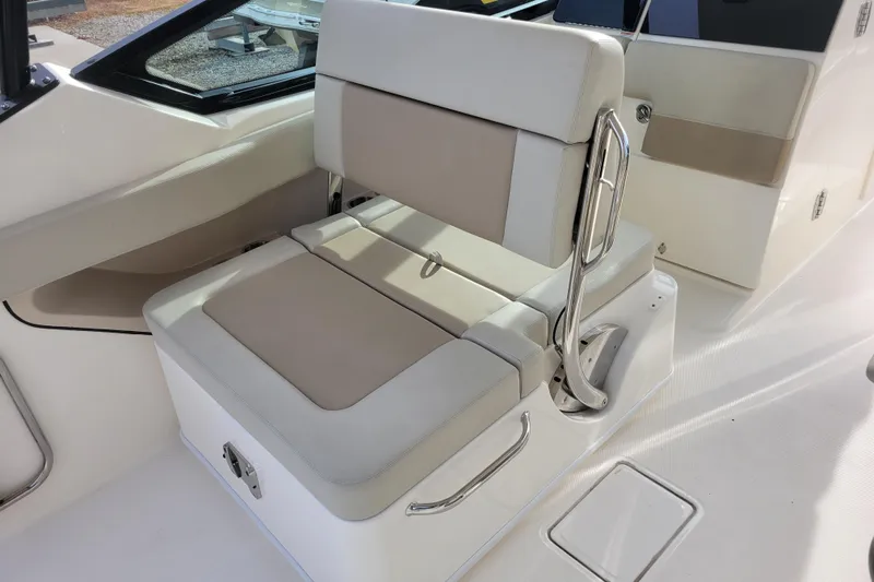  Yacht Photos Pics 2023 Boston Whaler 280 Vantage boat seating area with beige and white upholstery.