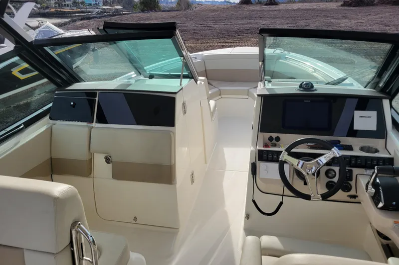  Yacht Photos Pics 2023 Boston Whaler 280 Vantage boat interior with modern helm and seating.