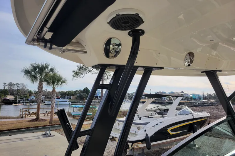  Yacht Photos Pics 2023 Boston Whaler 280 Vantage boat detail with scenic waterfront background.
