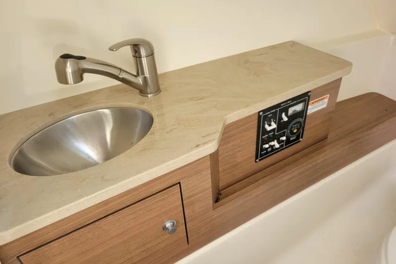  Yacht Photos Pics 2023 Boston Whaler 280 Vantage boat sink and control panel, featuring modern design.