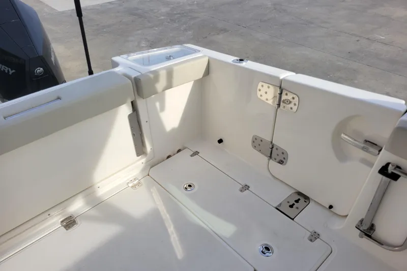  Yacht Photos Pics 2023 Boston Whaler 280 Vantage boat interior with storage compartments and seating.