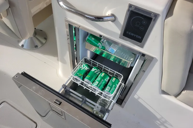  Yacht Photos Pics Built-in cooler on 2023 Boston Whaler 280 Vantage, stocked with drinks and water bottles.
