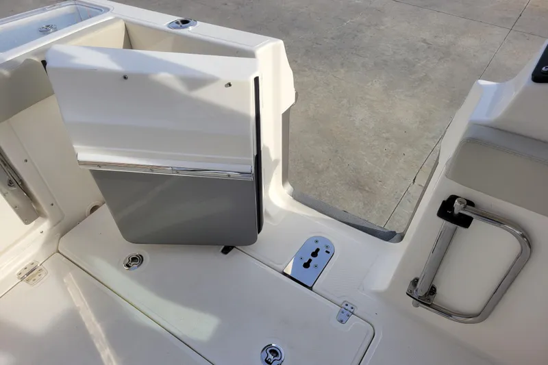  Yacht Photos Pics 2023 Boston Whaler 280 Vantage boat interior with open door and seating area.