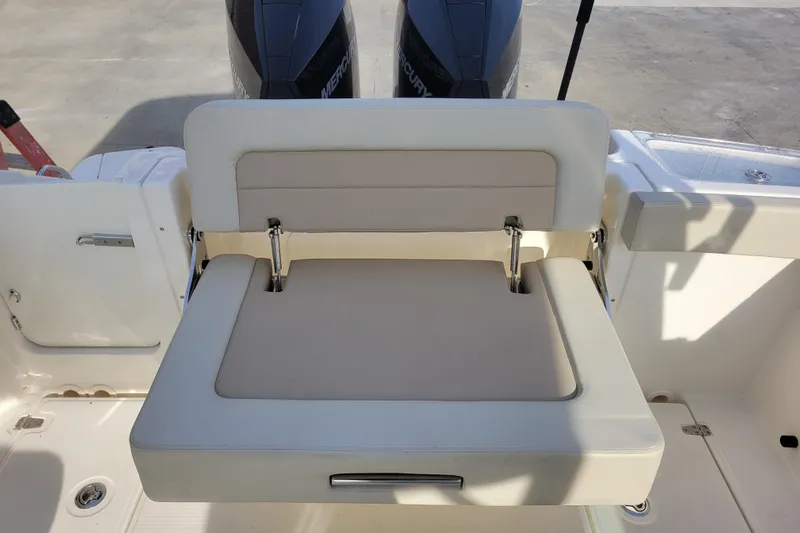  Yacht Photos Pics 2023 Boston Whaler 280 Vantage boat seat with dual Mercury engines in background.