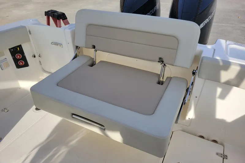  Yacht Photos Pics 2023 Boston Whaler 280 Vantage boat seat with beige upholstery and adjustable backrest.