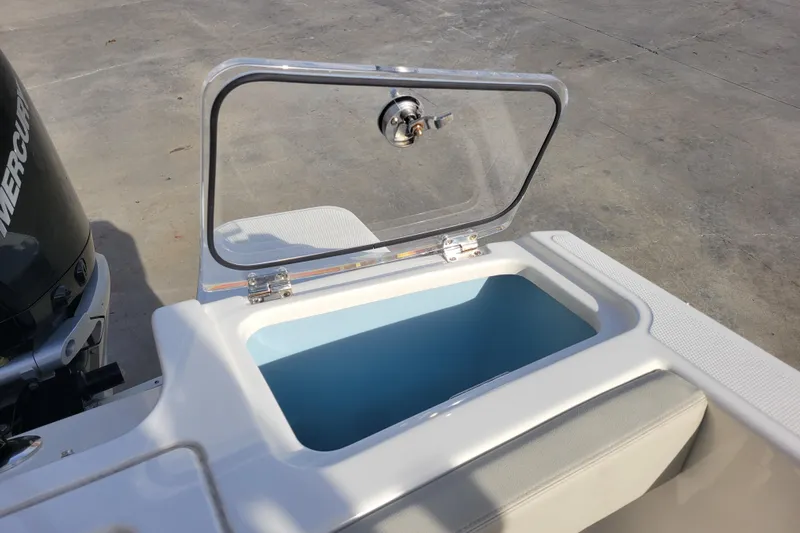  Yacht Photos Pics Open storage compartment on 2023 Boston Whaler 280 Vantage boat, with visible Mercury engine.