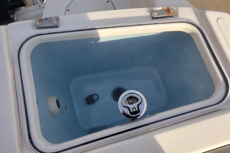  Yacht Photos Pics Livewell on 2023 Boston Whaler 280 Vantage boat, featuring a clear lid and latch.