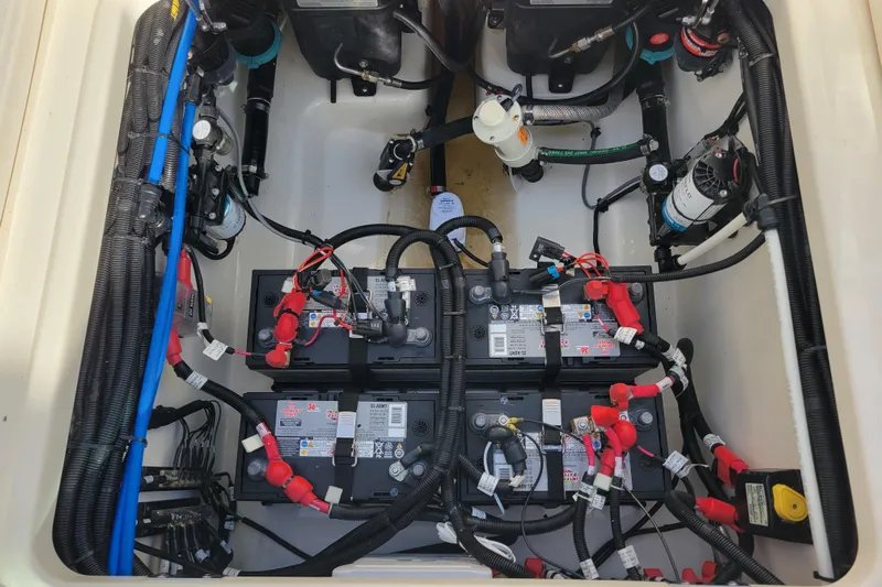  Yacht Photos Pics Battery compartment of 2023 Boston Whaler 280 Vantage boat, showcasing wiring and components.
