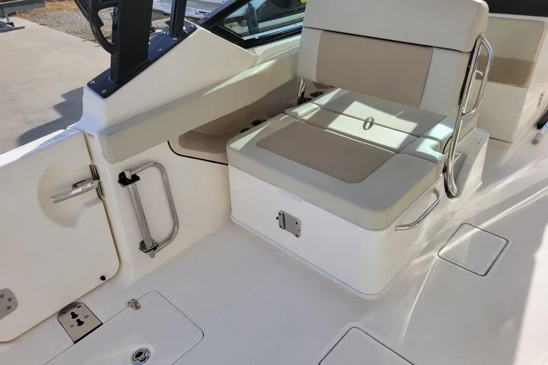  Yacht Photos Pics 2023 Boston Whaler 280 Vantage boat interior with seating and stainless steel fixtures.