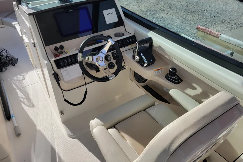  Yacht Photos Pics 2023 Boston Whaler 280 Vantage helm with steering wheel and controls.