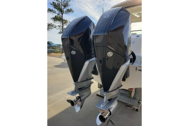  Yacht Photos Pics Twin outboard engines on a 2023 Boston Whaler 280 Vantage boat, parked outdoors.