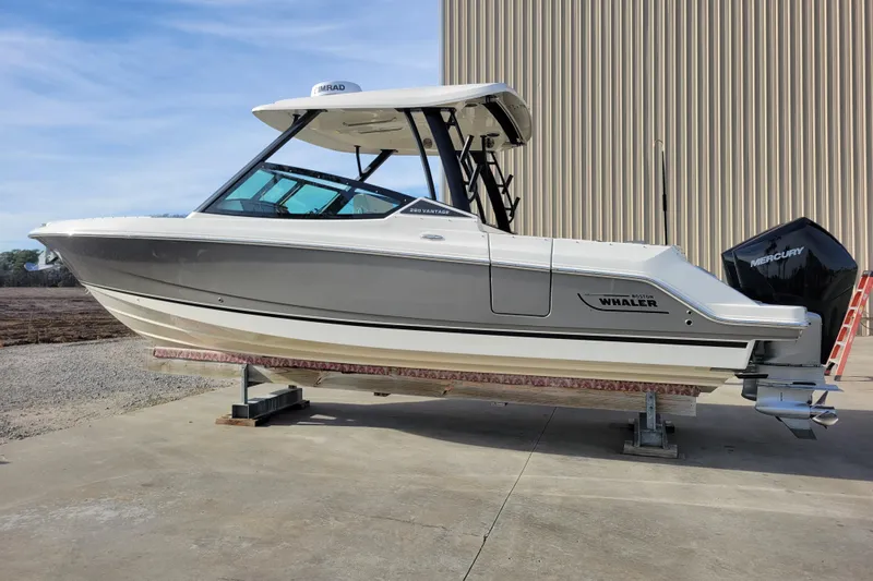  Yacht Photos Pics 2023 Boston Whaler 280 Vantage boat on display, featuring sleek design and Mercury engine.