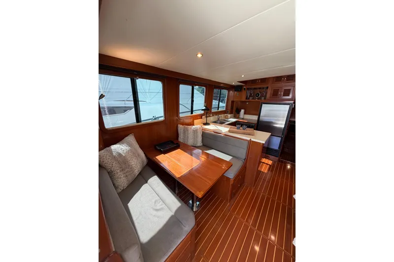 Angels Envy Yacht Photos Pics Interior of 2006 North Pacific 42 yacht with dining area and kitchen.