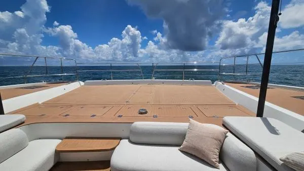 Sunlove Yacht Photos Pics 2024 Lagoon SIXTY 7 yacht deck with ocean view and comfortable seating.