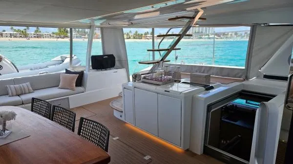 Sunlove Yacht Photos Pics Luxurious interior of 2024 Lagoon SIXTY 7 yacht with ocean view.