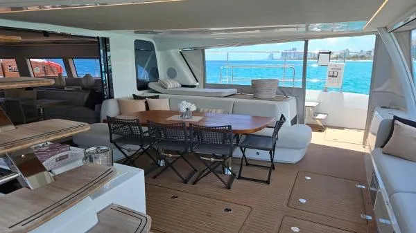 Sunlove Yacht Photos Pics Luxurious 2024 Lagoon SIXTY 7 yacht interior with elegant seating and ocean view.