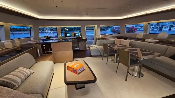 Sunlove Yacht Photos Pics Luxurious interior of 2024 Lagoon SIXTY 7 yacht with modern furnishings and ambient lighting.
