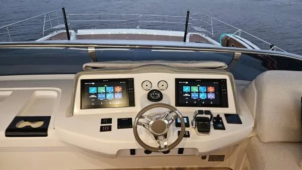 Sunlove Yacht Photos Pics 2024 Lagoon SIXTY 7 yacht helm with dual screens and modern controls.