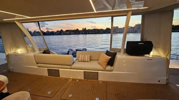 Sunlove Yacht Photos Pics Luxurious 2024 Lagoon SIXTY 7 yacht interior with sunset view over the water.