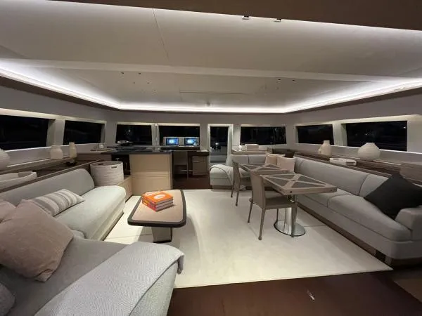 Sunlove Yacht Photos Pics Luxurious interior of 2024 Lagoon SIXTY 7 yacht with modern furnishings and ambient lighting.