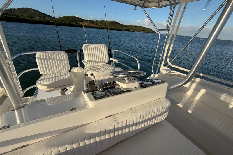  Yacht Photos Pics 2005 Luhrs 38 Convertible boat interior with helm, seats, and ocean view.