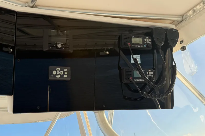  Yacht Photos Pics 2005 Luhrs 38 Convertible boat dashboard with communication equipment and controls.