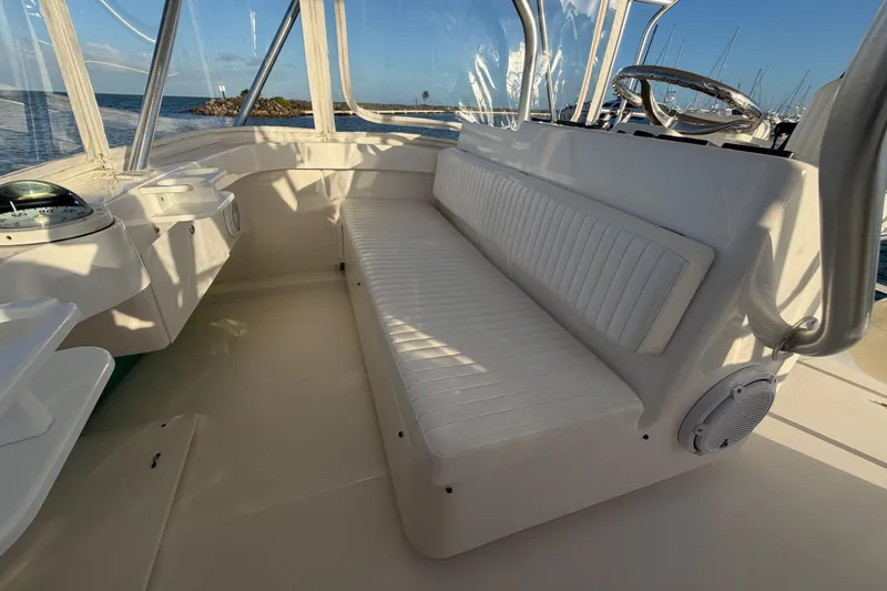  Yacht Photos Pics 2005 Luhrs 38 Convertible boat interior with white seating and ocean view.