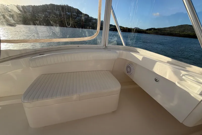  Yacht Photos Pics 2005 Luhrs 38 Convertible boat interior with cushioned seating and scenic water view.