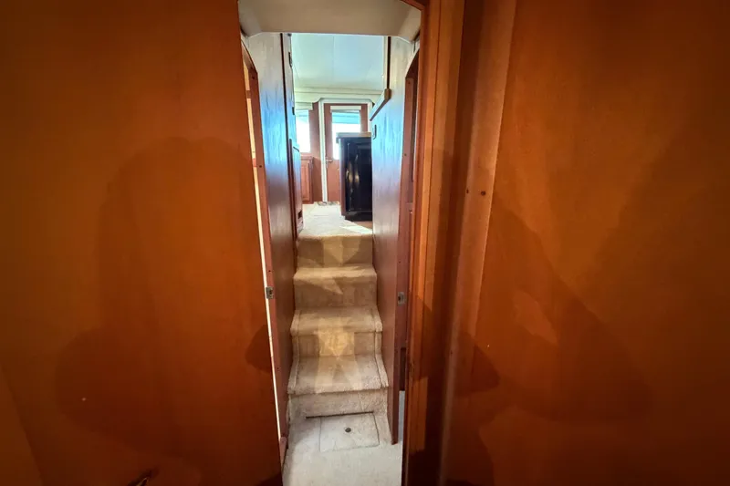  Yacht Photos Pics Interior hallway of 2005 Luhrs 38 Convertible yacht with carpeted stairs.