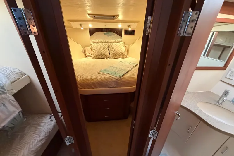  Yacht Photos Pics 2005 Luhrs 38 Convertible yacht interior with cozy bedroom and bathroom.