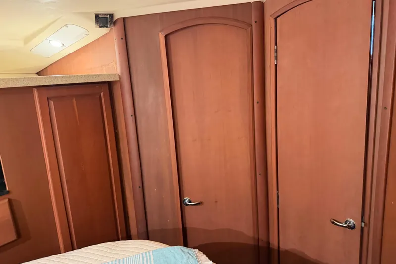  Yacht Photos Pics Interior of 2005 Luhrs 38 Convertible with wooden doors and modern lighting.