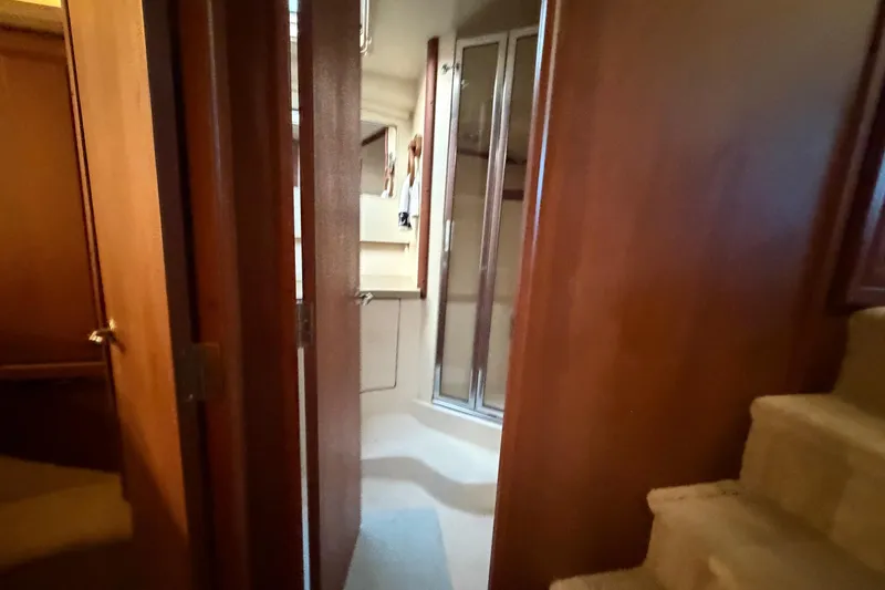  Yacht Photos Pics Interior of 2005 Luhrs 38 Convertible yacht showing bathroom and wooden cabinetry.